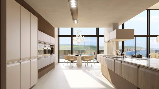 Cocina en tonos cálidos muy iluminada con electrodomésticos integrados e isla de cocina central con fregadero y vitrocerámica integrados